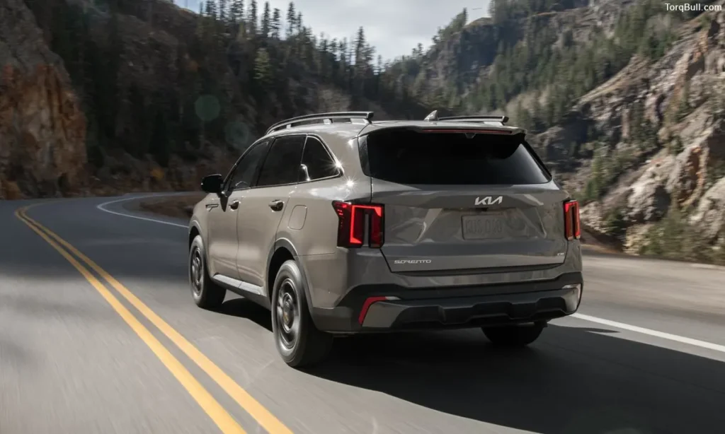 Kia Sorento driving on mountain rear view 304958
