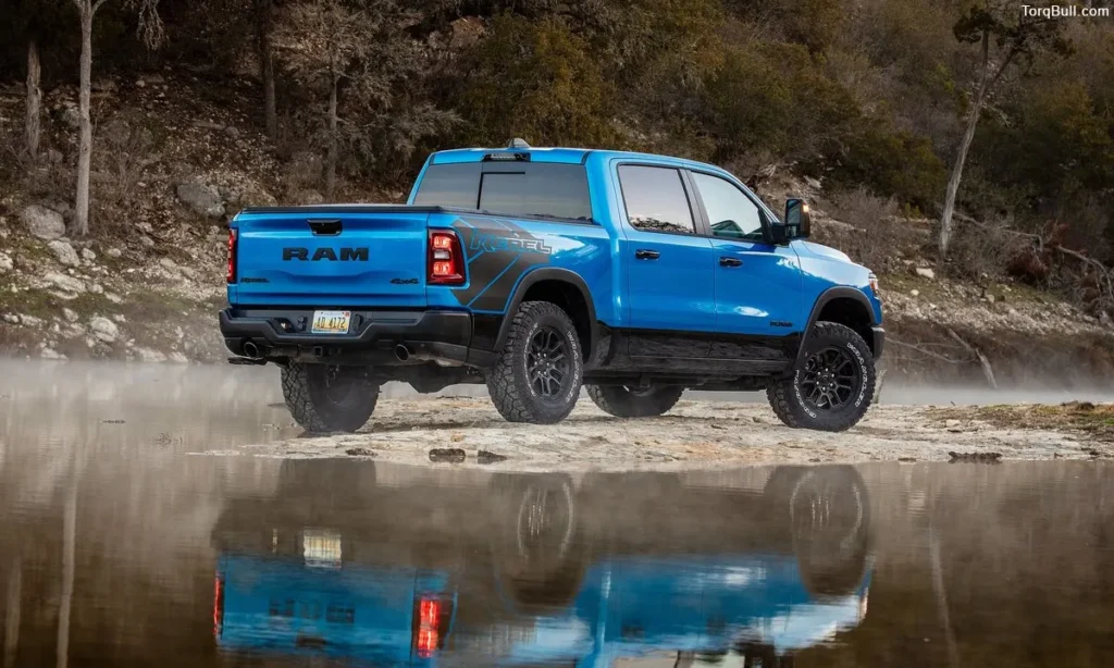 Blue Ram 1500 rear profile near lake