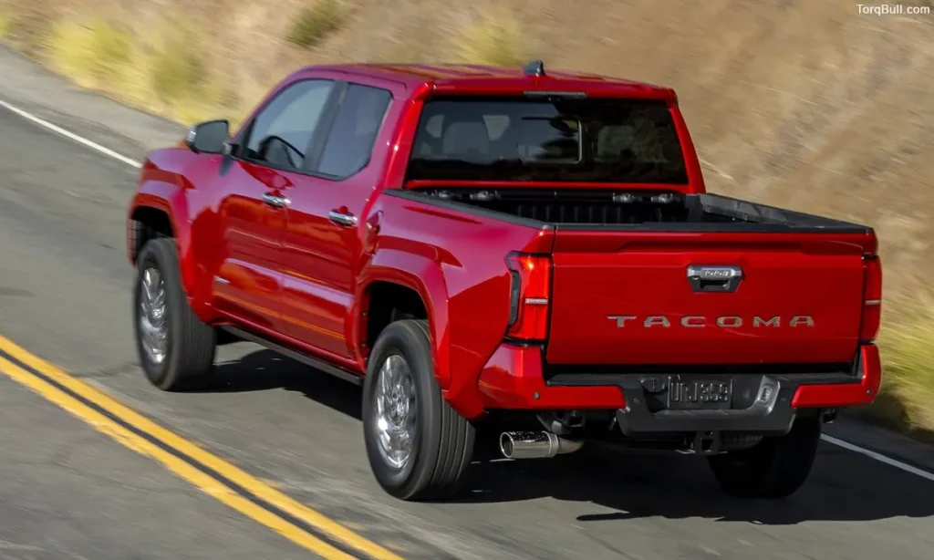 Toyota Tacoma on mountain road rear view 3248957