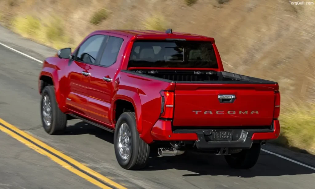 Toyota Tacoma on road in mountain rear view 30495