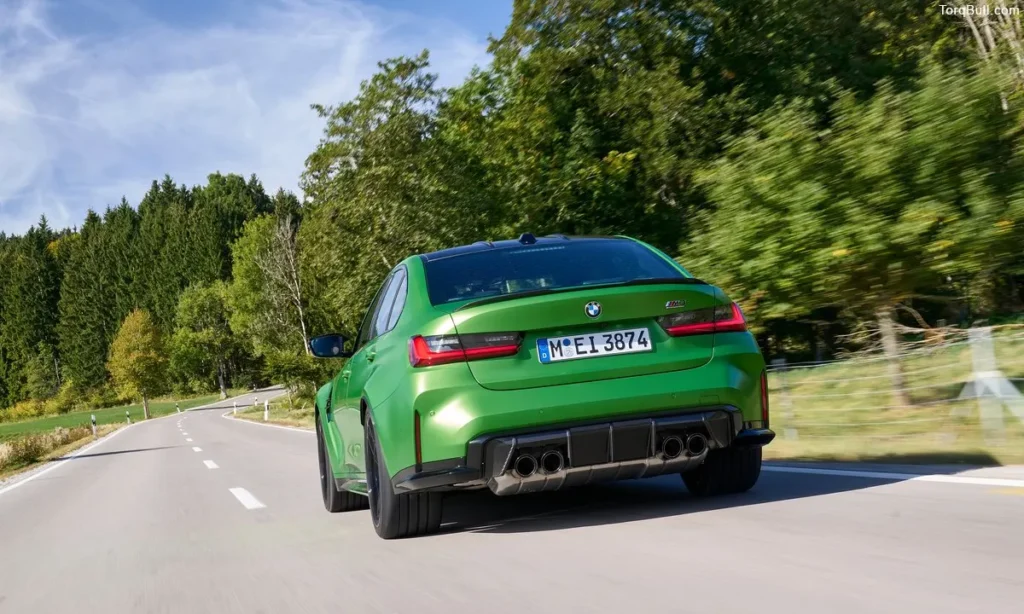 BMW M3 driving on highway rear view 908345