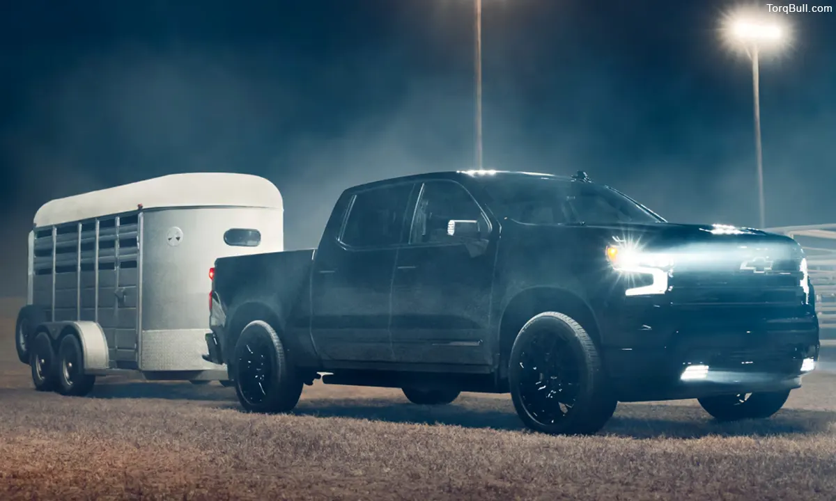 Chevrolet Silverado towing at night