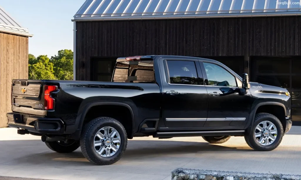 Black Chevrolet Silverado parking near garage 309485