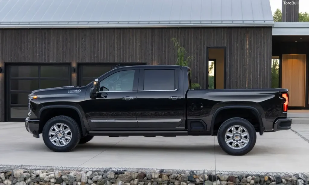 Chevrolet Silverado side view infront of garage