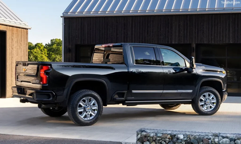 Chevrolet Silverado side rear view infront of garage