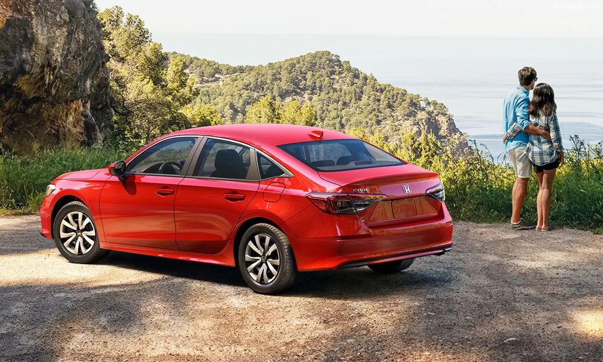 Honda Civic with couple posing near mountain