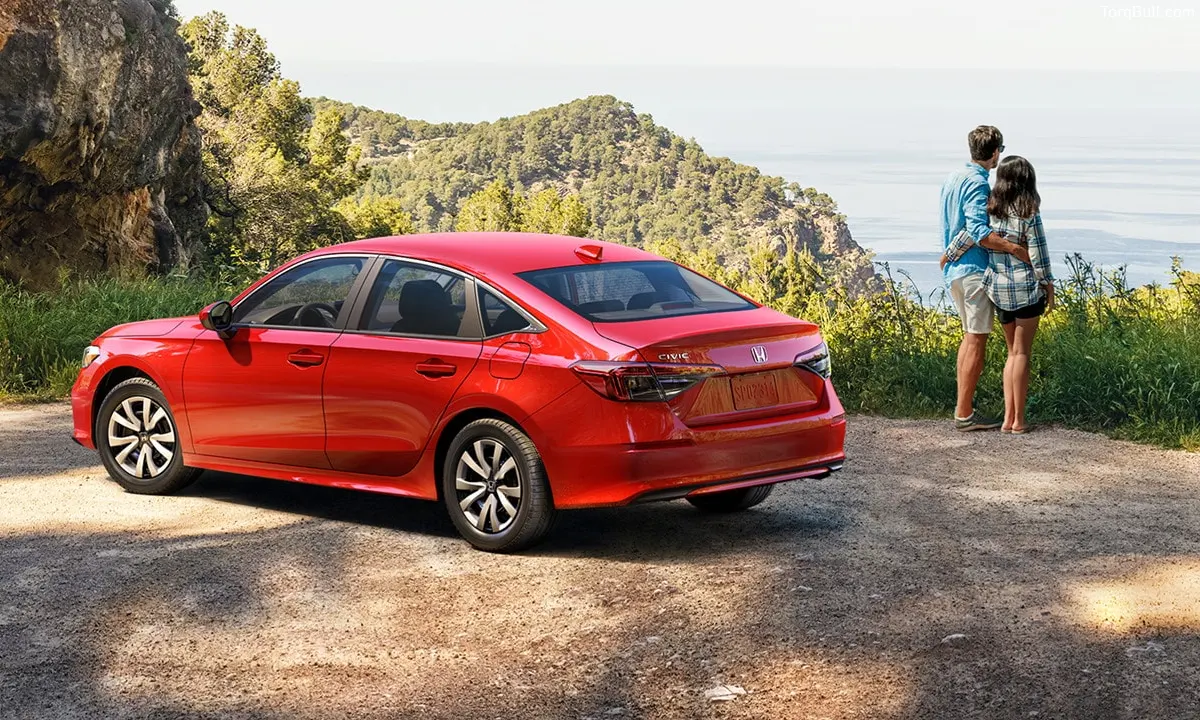 Honda Civic with couple up in the mountain