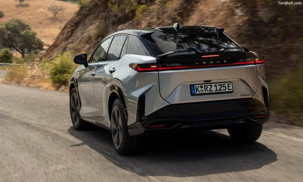 Lexus RZ rear view on mountain road