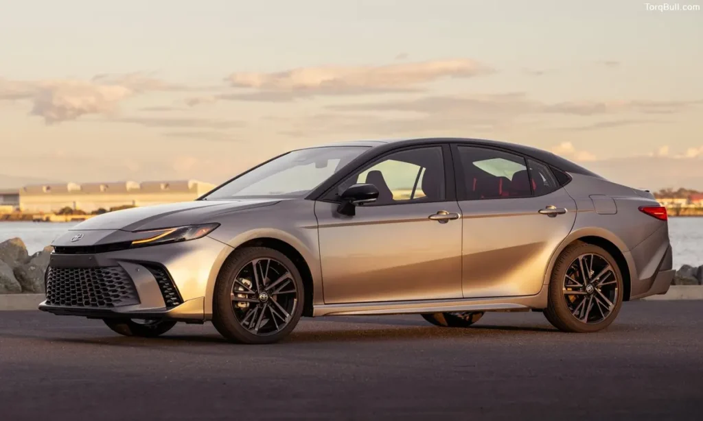 Toyota Camry parking in the sunset near lake