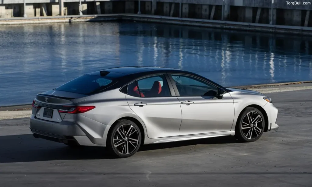 Toyota Camry rear view infront of the lake