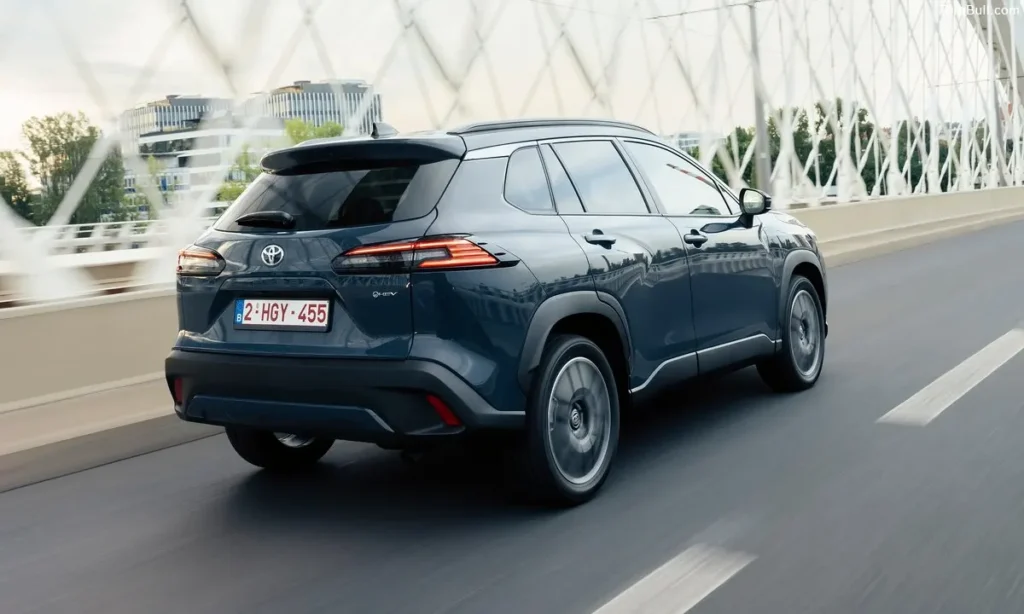 Toyota Corolla Cross running on bridge back view