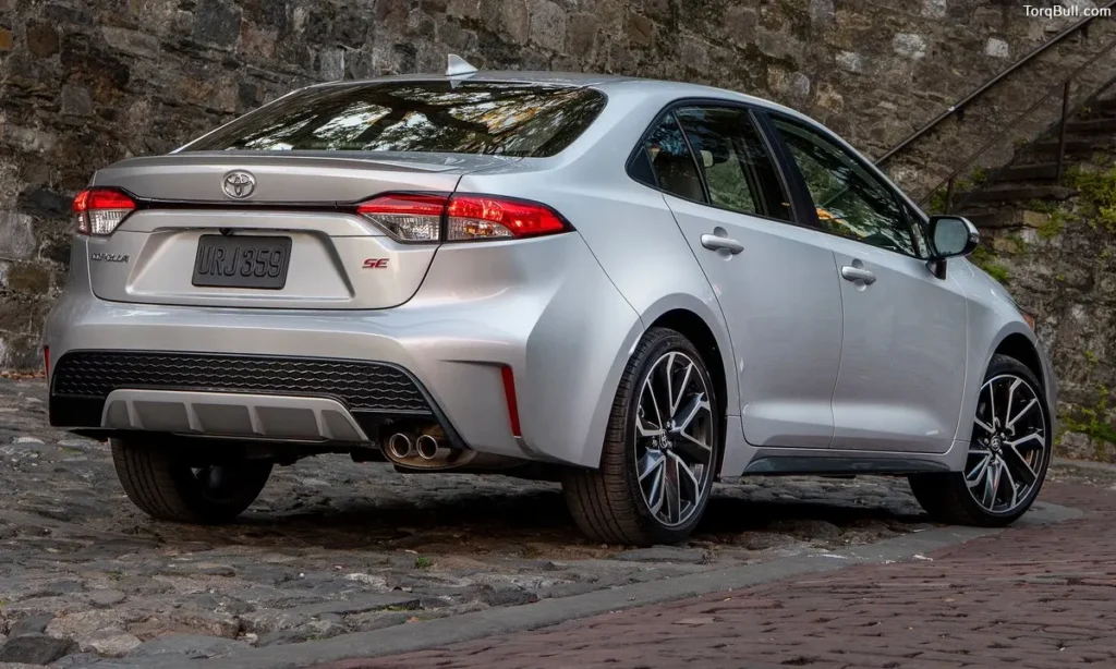 White Toyota Corolla Rough Terrain