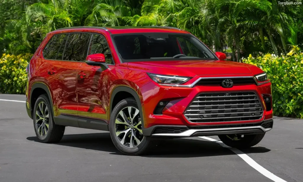 Toyota Grand Highlander near greenary
