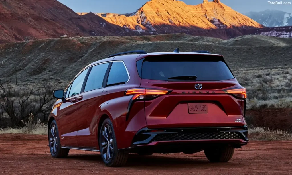 Toyota Sienna rear view near mountain