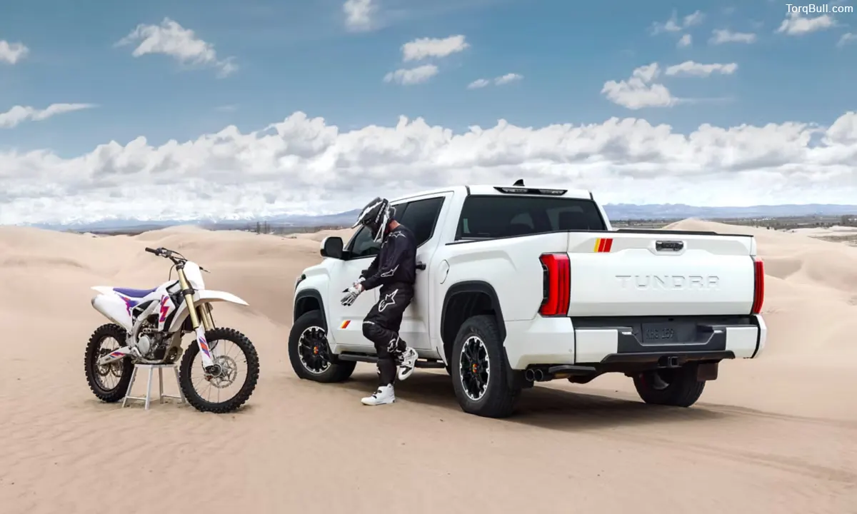 Toyota Tundra rear view in the back with motorcycle